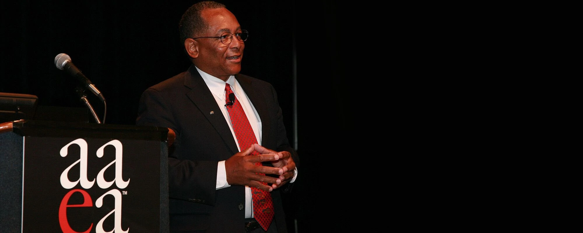 Man at the stage presenting